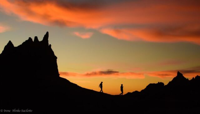 Hikers on Ridge At Sunset